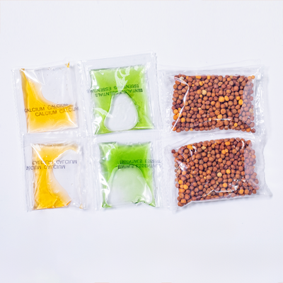 Four transparent packages containing different plant food items on a white background
